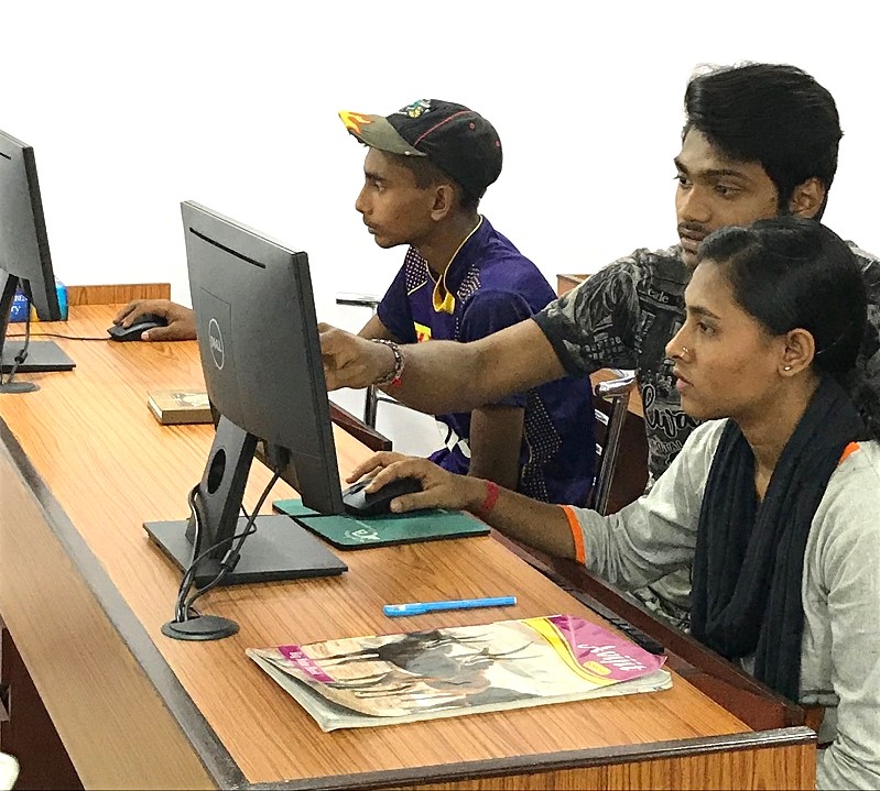 3 students working on computers